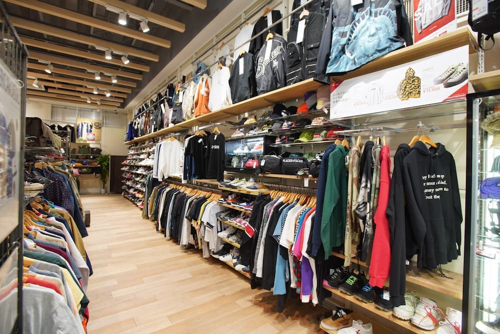 Inside a 2nd Street resale store, racks of curated secondhand apparel